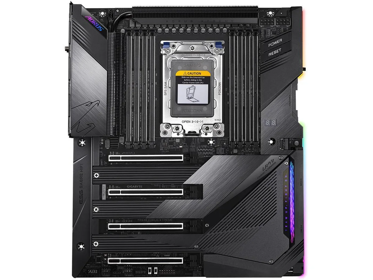 Large black ATX motherboard with silver heatsinks and integrated I/O shield