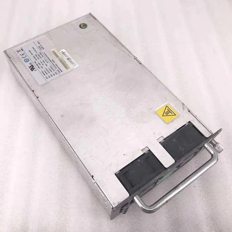 Rectangular black metal power supply module with front label and rear connectors