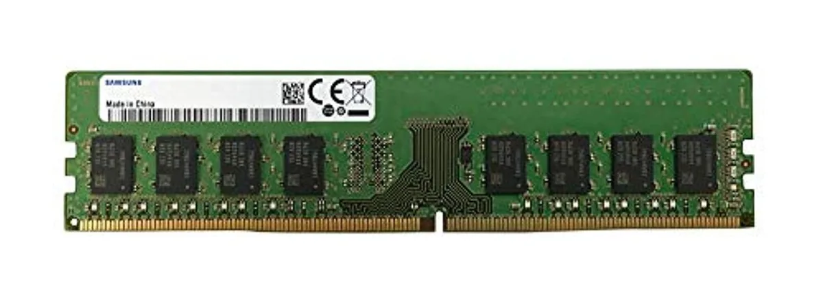 Green printed circuit board with black memory chips and gold edge connectors