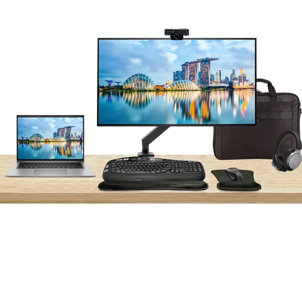 A 14 inch touchscreen laptop and a 32 inch 4K monitor on a desk mount with keyboard, mouse, webcam, headphones and briefcase