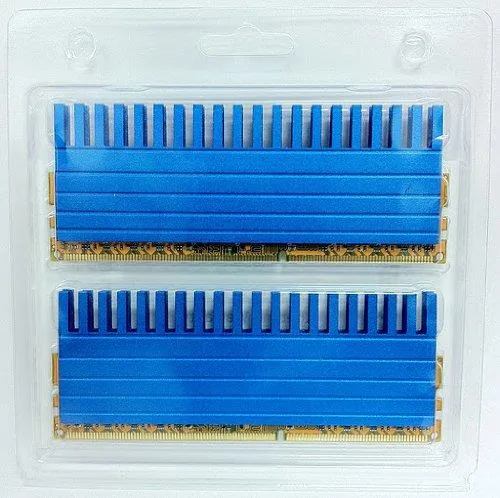 Four black rectangular memory modules with metallic crown-shaped heatspreaders side by side
