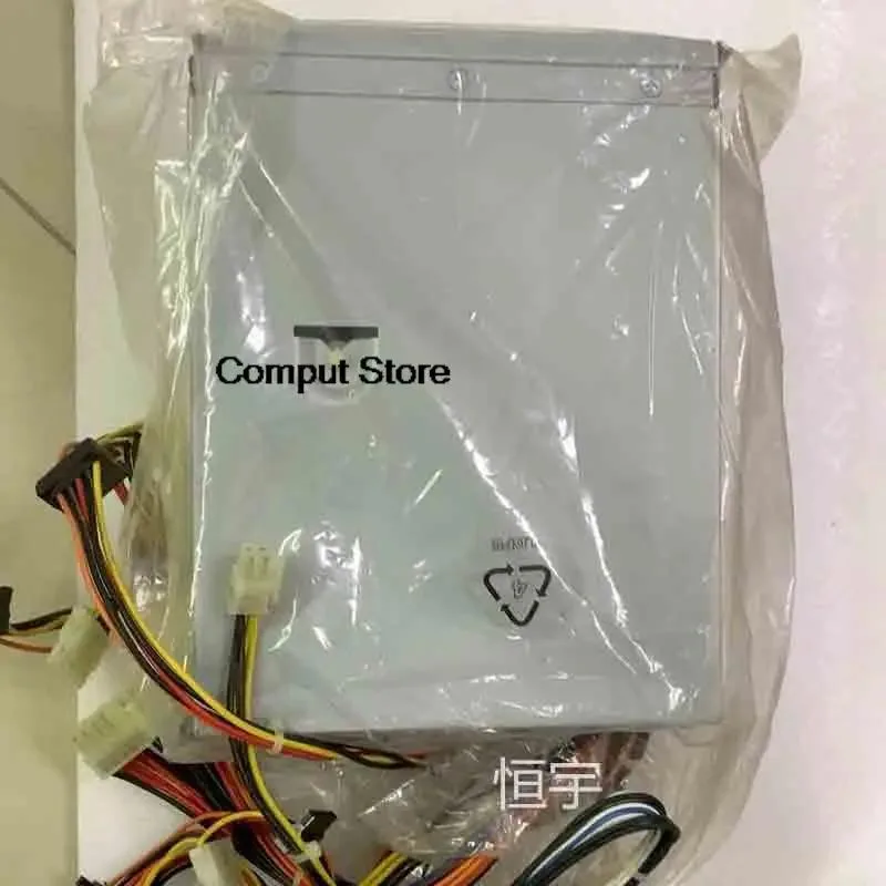 Rectangular silver server PSU unit with rear fan grille and power connector visible