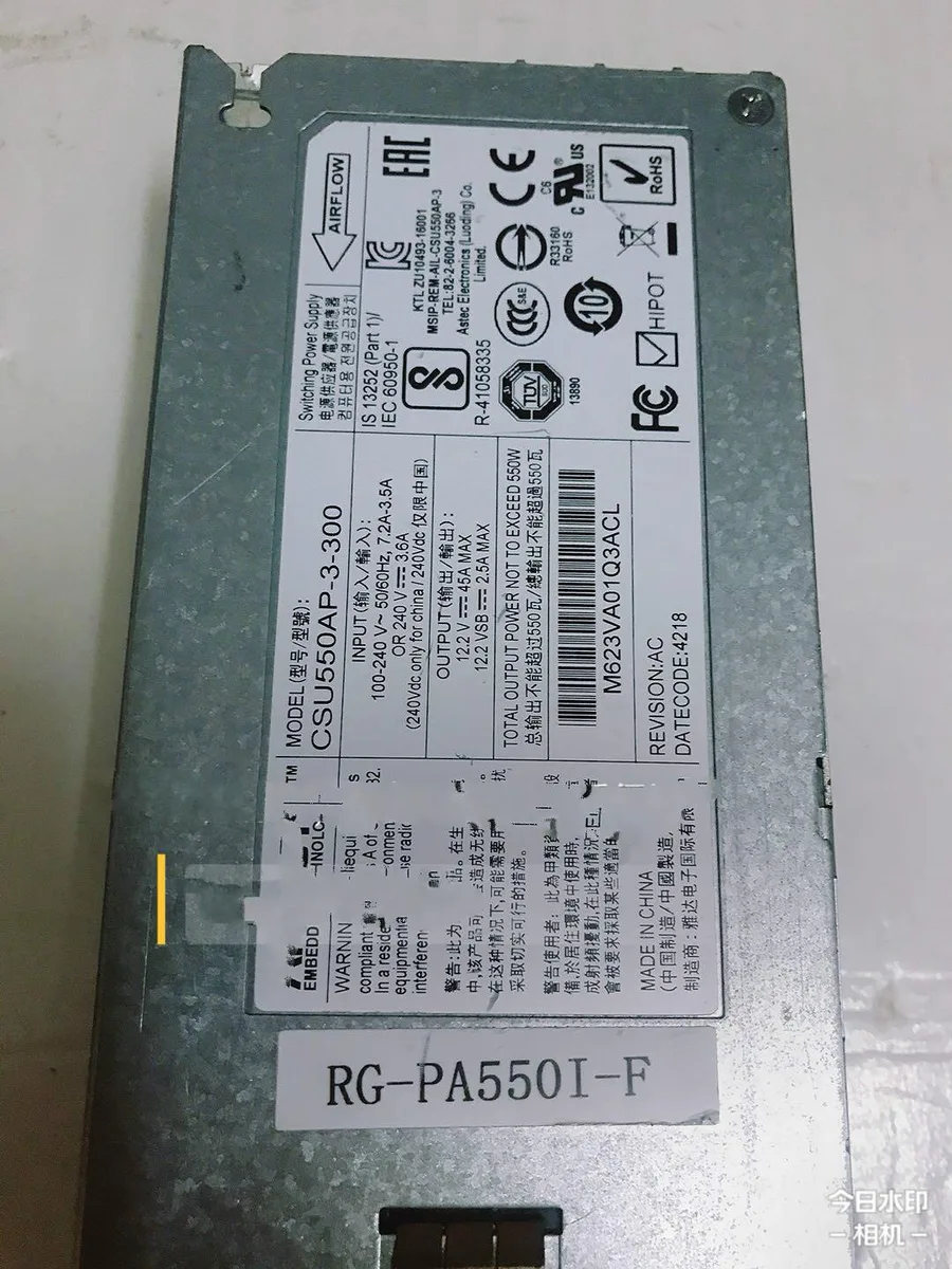 Silver rectangular server power supply unit with label showing 550W rating