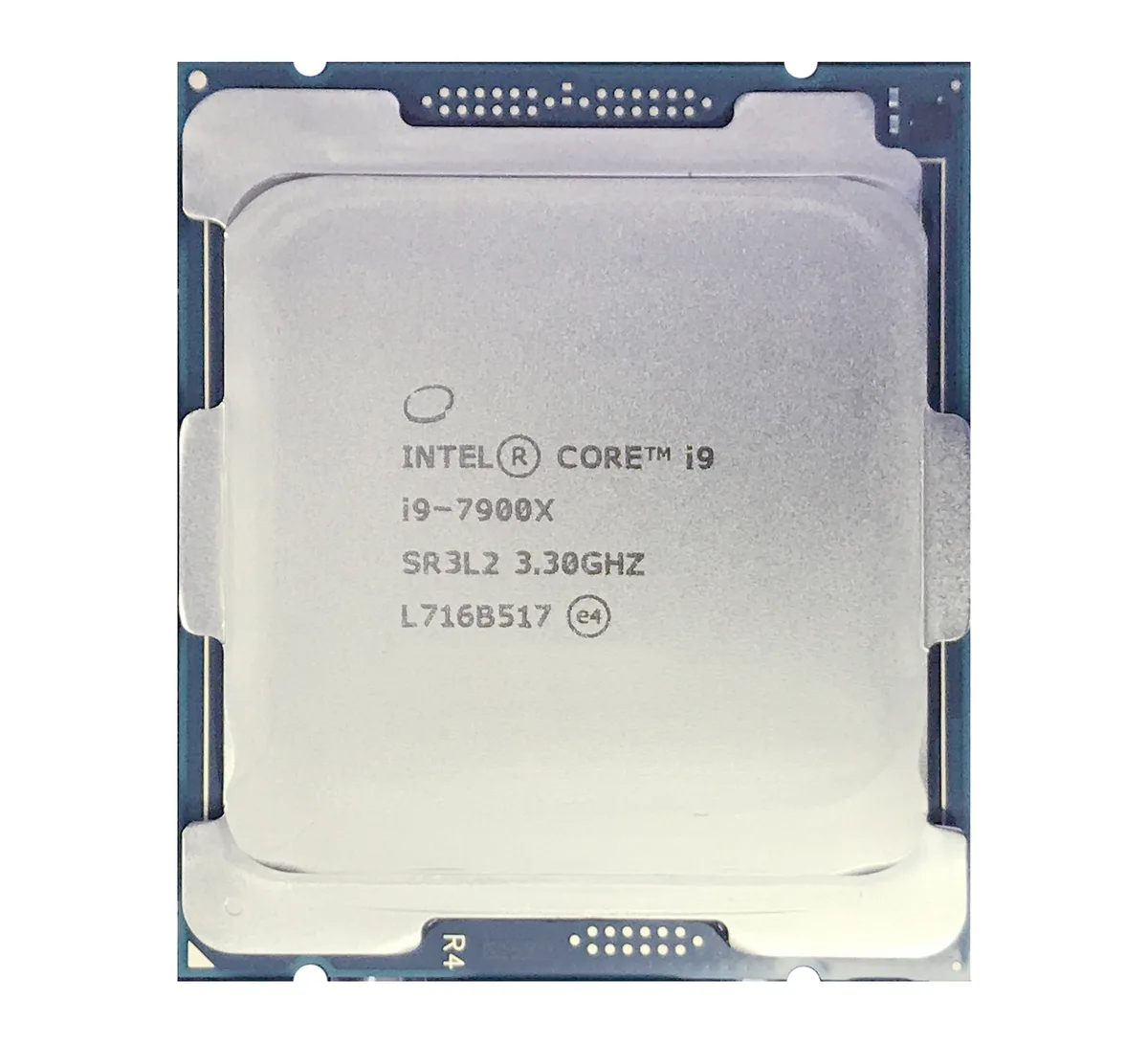 Square green ceramic chip with gold contacts and silver heat spreader, LGA2066 socket form factor