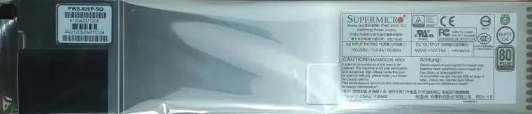 Rectangular silver server power supply unit with rear ventilation grille and power socket
