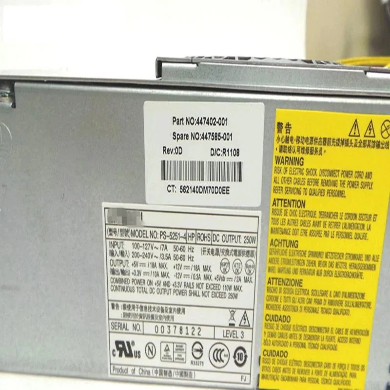 Rectangular silver TFX power supply unit with fan grille and cable bundle
