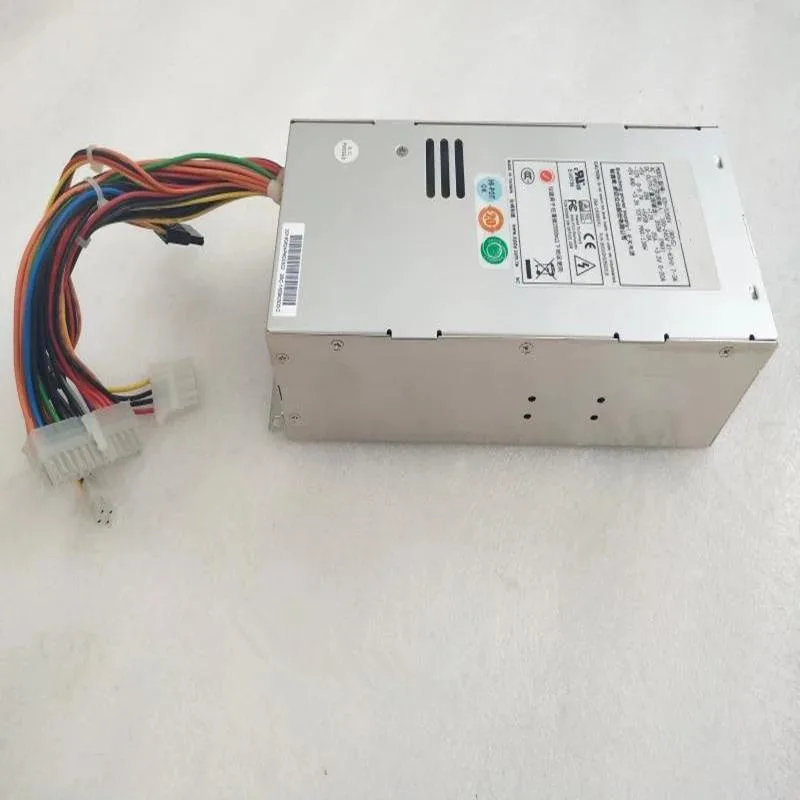 Rectangular 2U metal power supply unit with rear fan grille and cable bundle