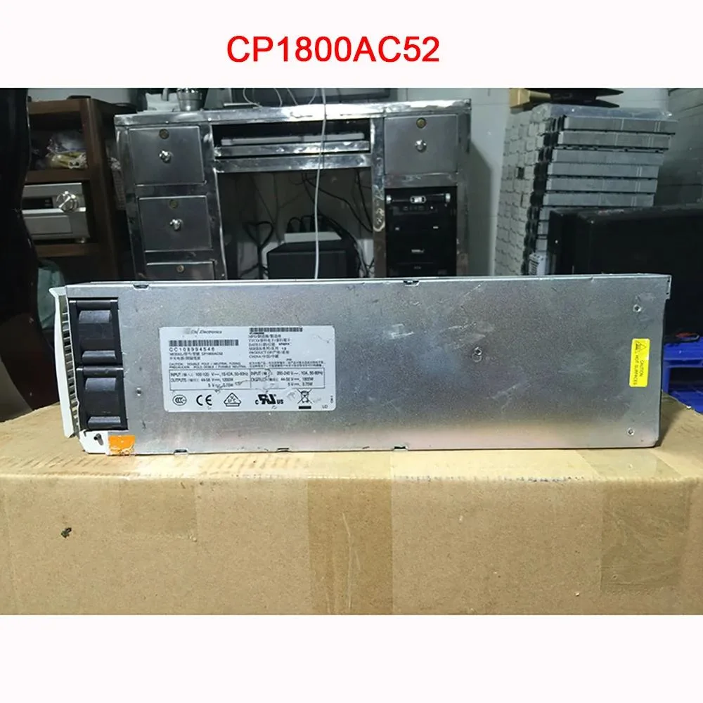 Rectangular silver ATX power supply unit with rear fan grille and connector panel