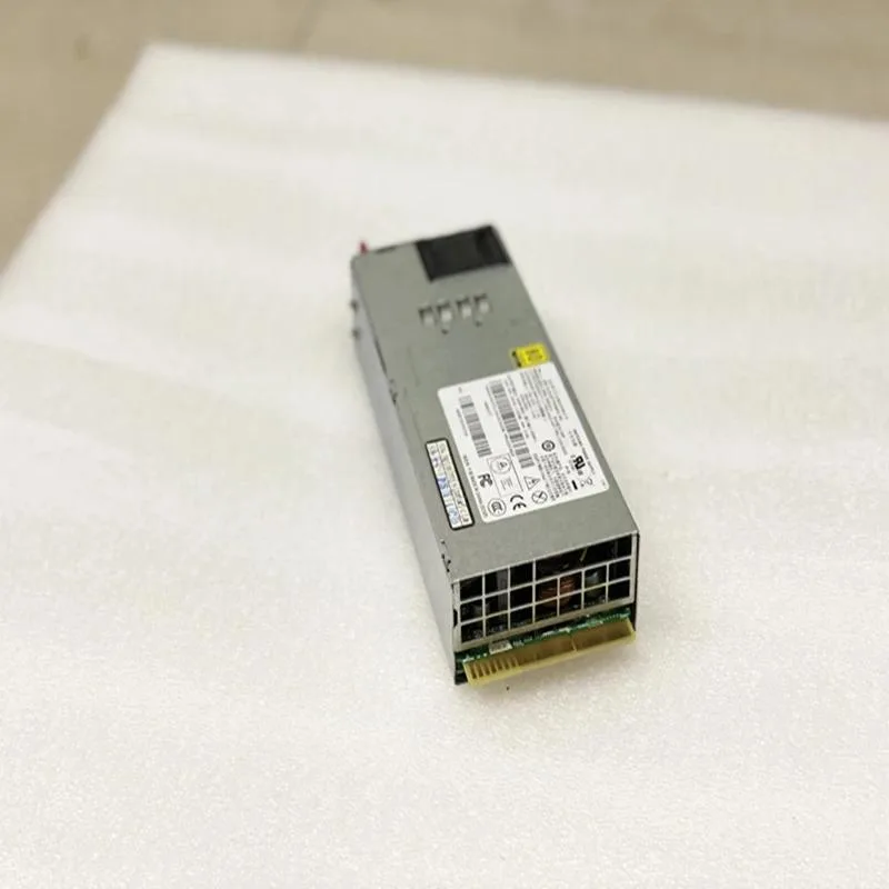 Rectangular ATX power supply unit with matte metal casing and rear fan grille