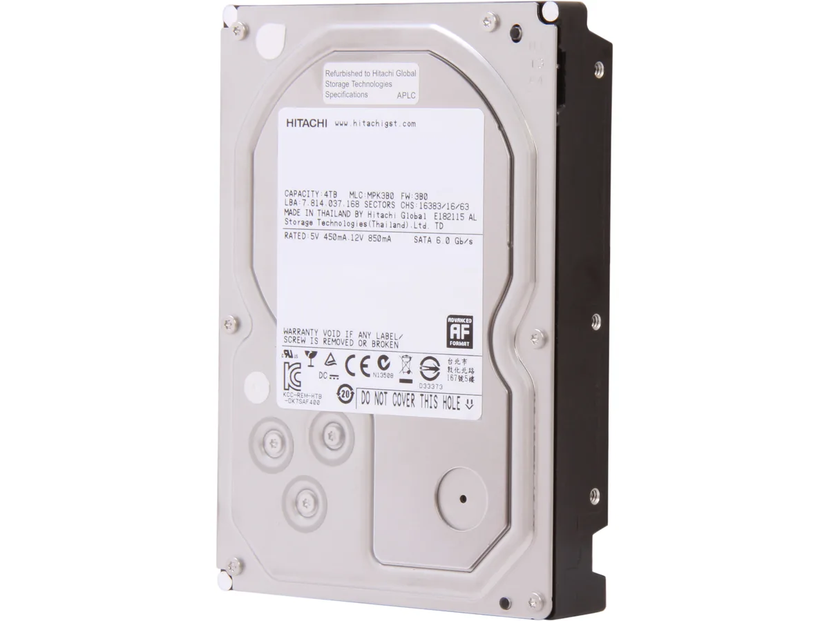Silver rectangular 3.5 inch bare hard drive with exposed circuit board
