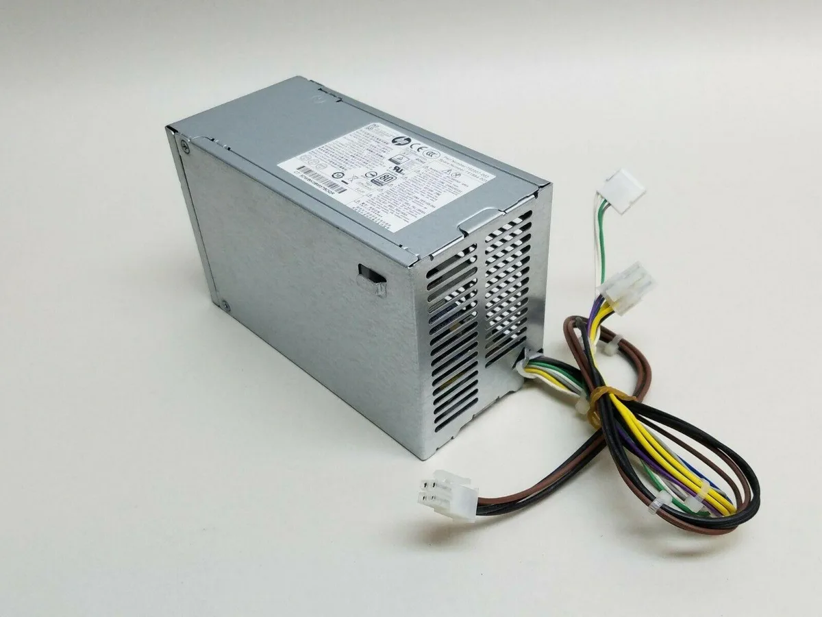 Rectangular silver metal power supply unit with fan grille and label sticker