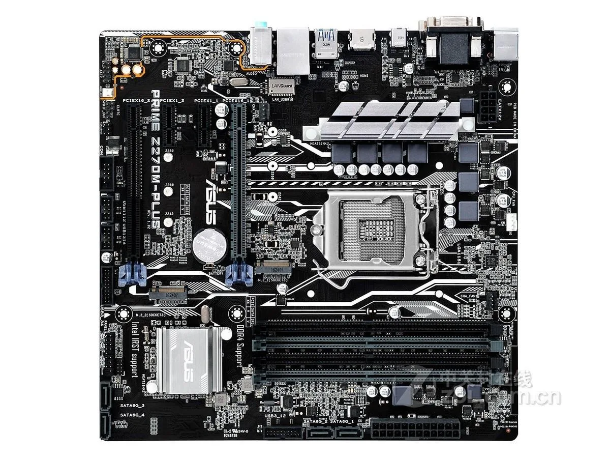 Green Micro ATX motherboard with black sockets and silver heatsinks