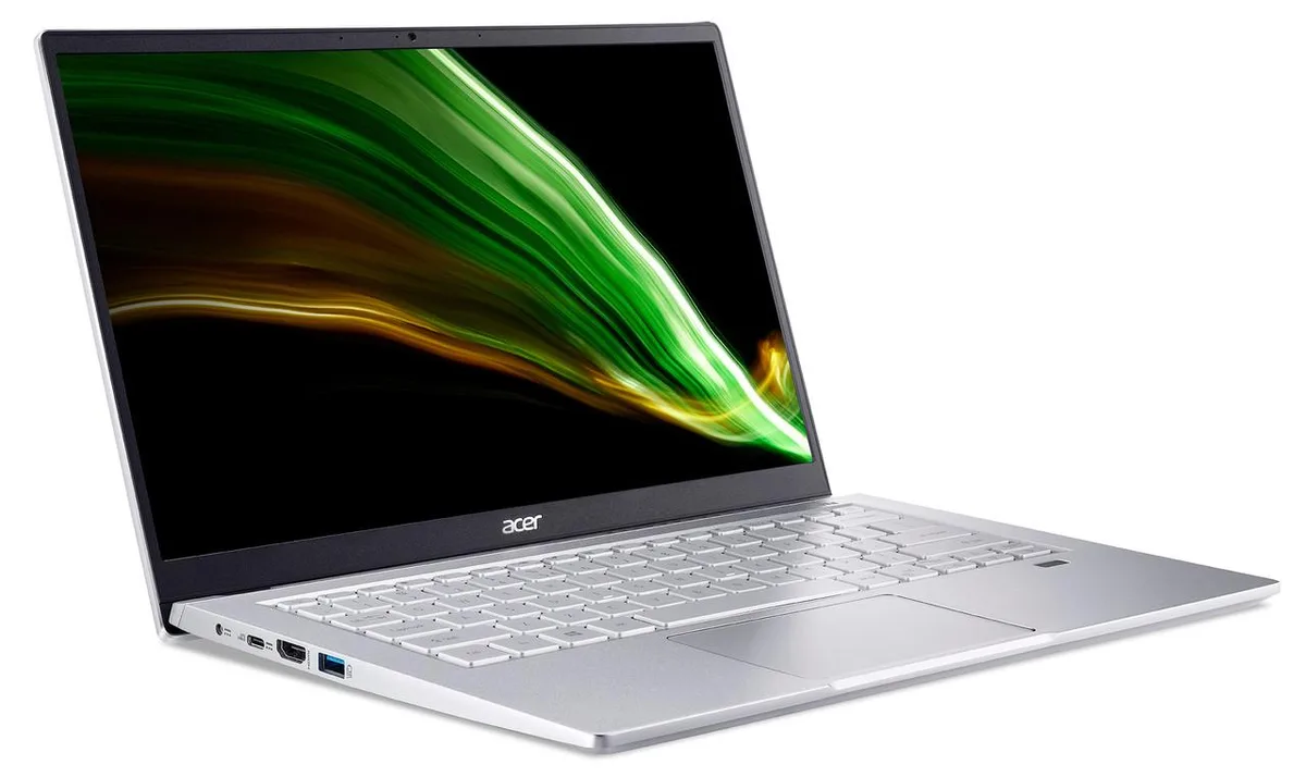 Silver Acer Swift 3 laptop with dents on lid, 14 inch screen