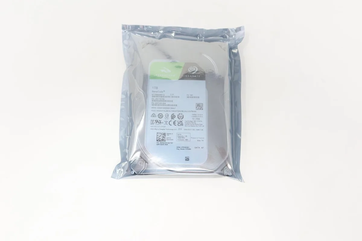 Silver 3.5 inch internal hard drive with SATA connector and circuit board visible
