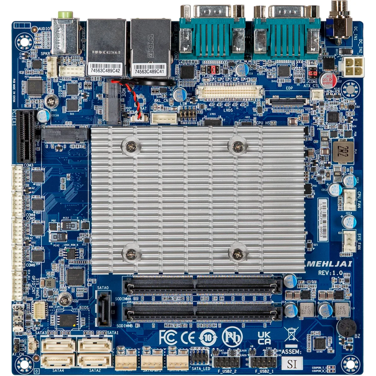 Compact Mini-ITX motherboard with silver heatsink, black PCB, rear I/O ports visible