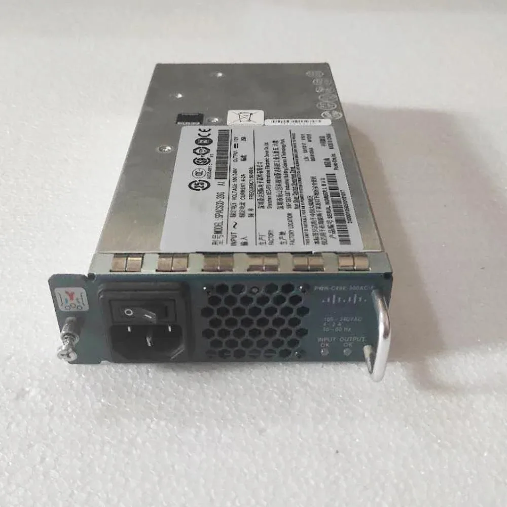 Rectangular silver metal power supply unit with front grille and label