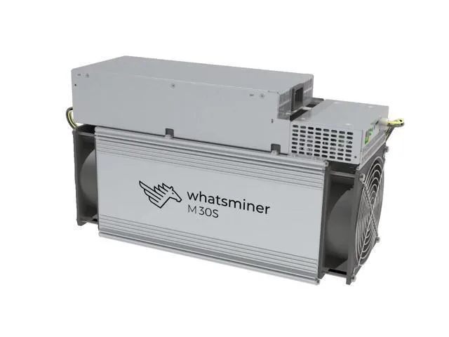 Rectangular silver ASIC miner with integrated PSU and power cords, Ethernet port visible