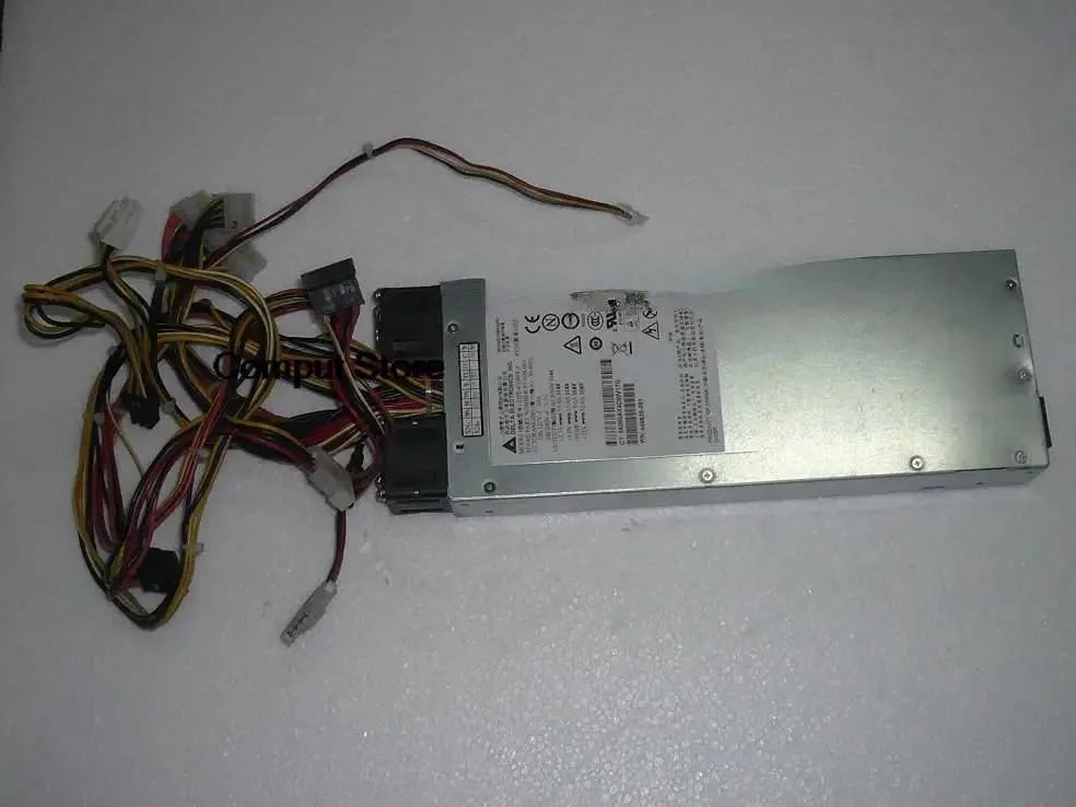 Rectangular silver server power supply unit with rear fan grille and power socket