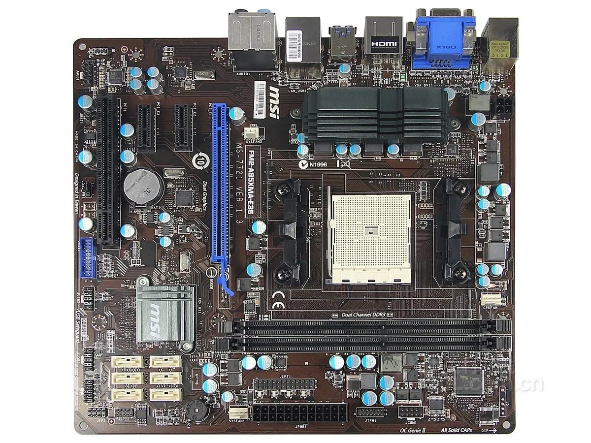 Green rectangular micro-ATX board with black sockets, silver heatsinks and a rear I/O shield