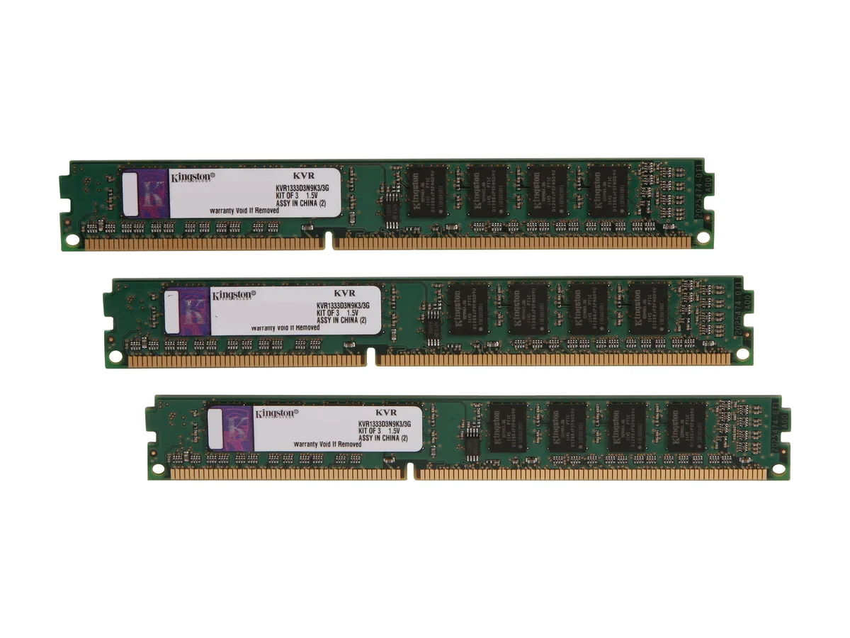 Three green DDR3 DIMMs with gold contacts in a triple-channel kit