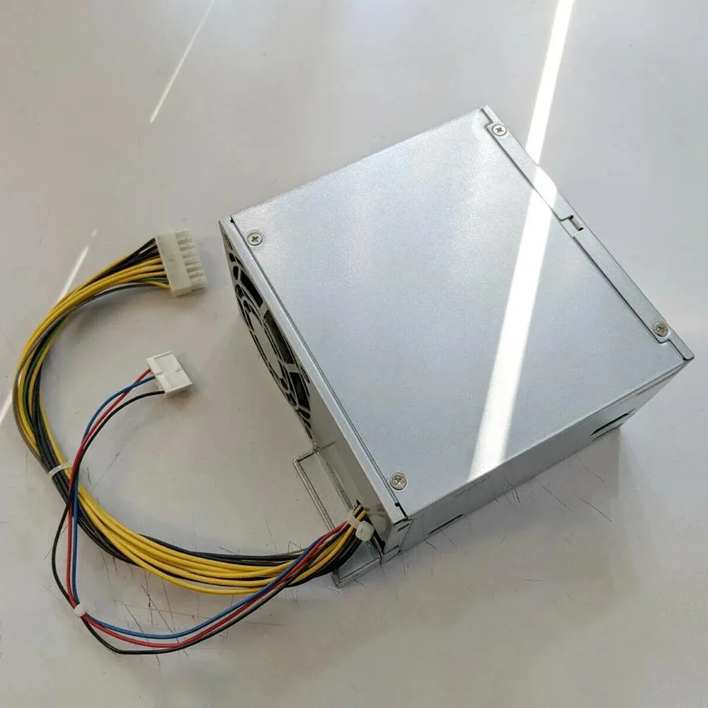 Rectangular metal ATX power supply unit, matte grey finish, fan grille visible