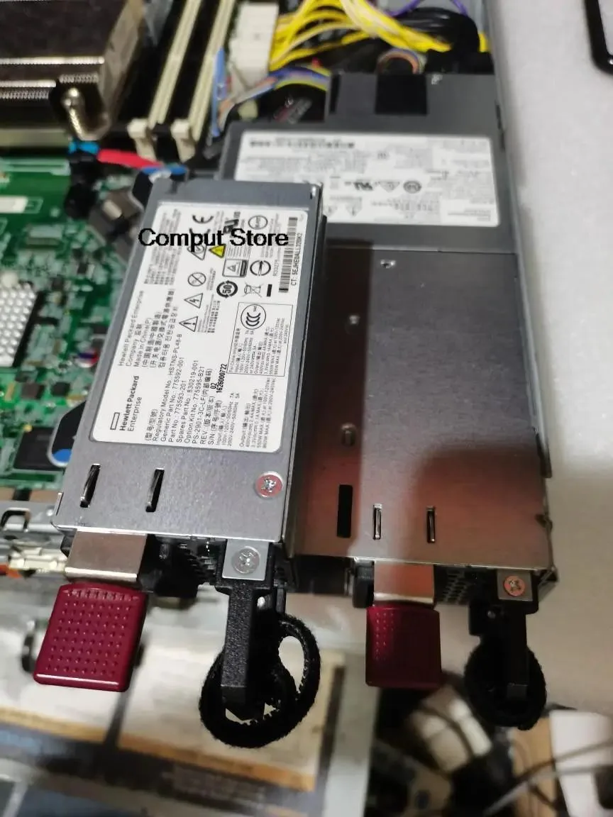 Rectangular black metal ATX power supply unit with ventilation grille and power connectors visible