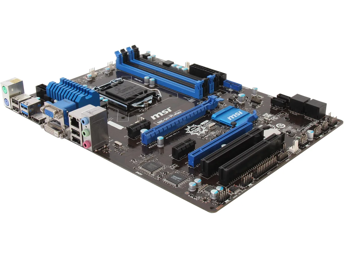 Green rectangular ATX motherboard with silver CPU socket, four black memory slots