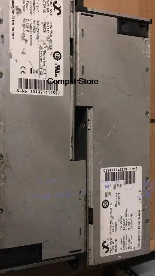 Rectangular silver ATX power supply module with label showing 48 400 99 241117.120