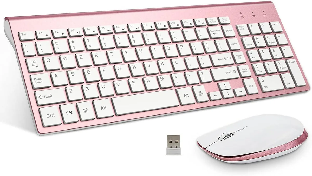 Pink rose gold wireless keyboard and mouse set, low-profile full-size keyboard with number pad, compact mouse, shared USB receiver