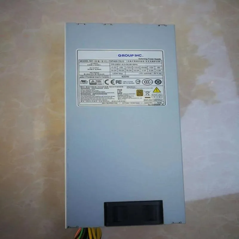 Silver 1U metal chassis power supply unit with rear fan grille and cable bundle
