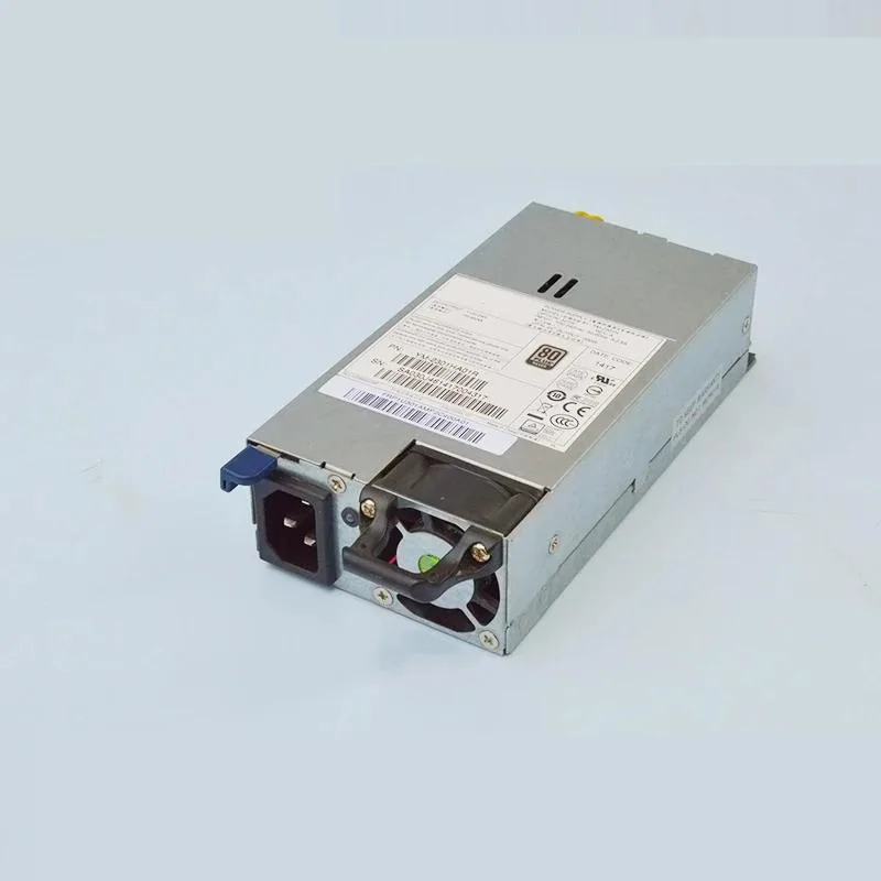 Silver rectangular ATX power supply unit with fan grille and power socket visible