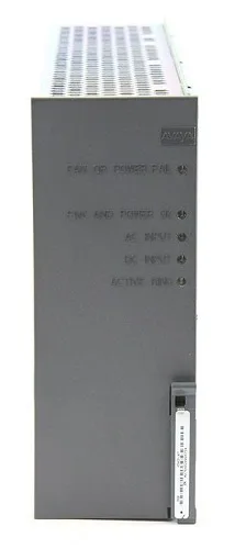 Rectangular silver metal power supply unit with ventilation grille and rear connector panel