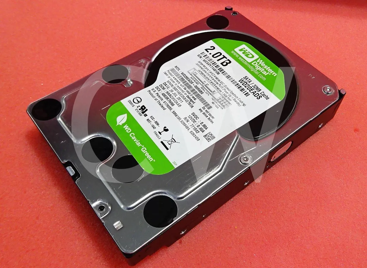 Silver 3.5 inch SATA hard drive with green circuit board visible on underside