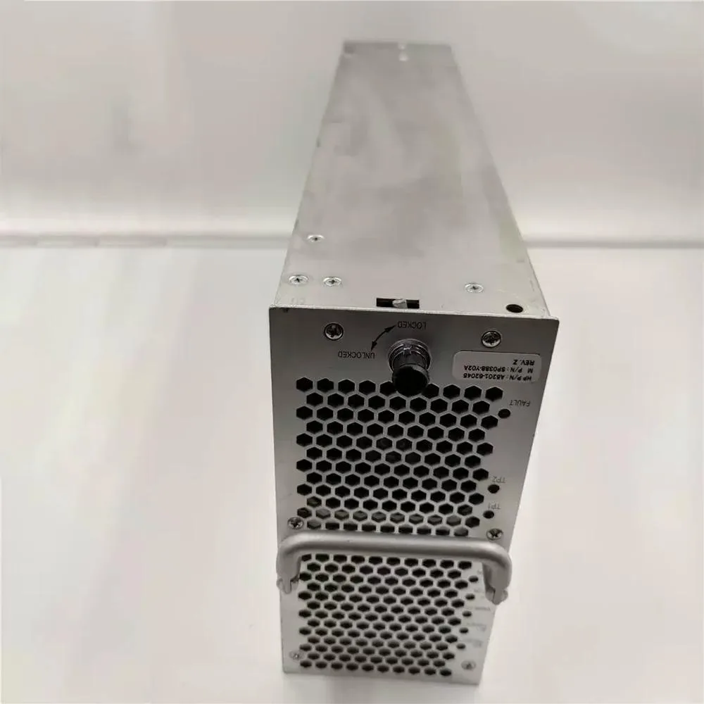 Rectangular silver ATX power supply unit with fan grille and cable bundle