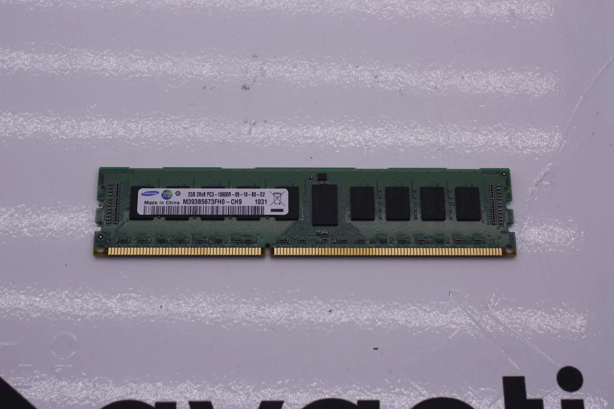 Green printed circuit board with 240 gold pins and black memory chips