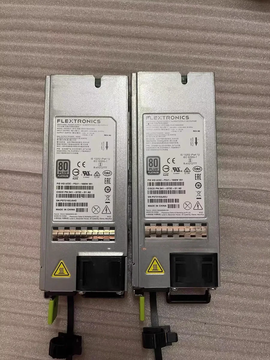Silver rectangular server power supply unit with rear fan grille and power socket