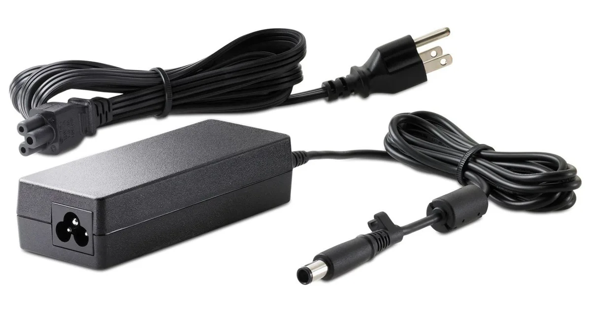 Small black rectangular desktop power adapter with cable