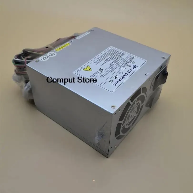 Silver ATX power supply unit with fan grille and power socket