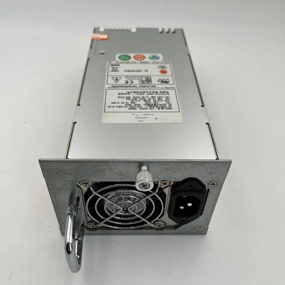 Silver rectangular ATX power supply unit with ventilation grille and label