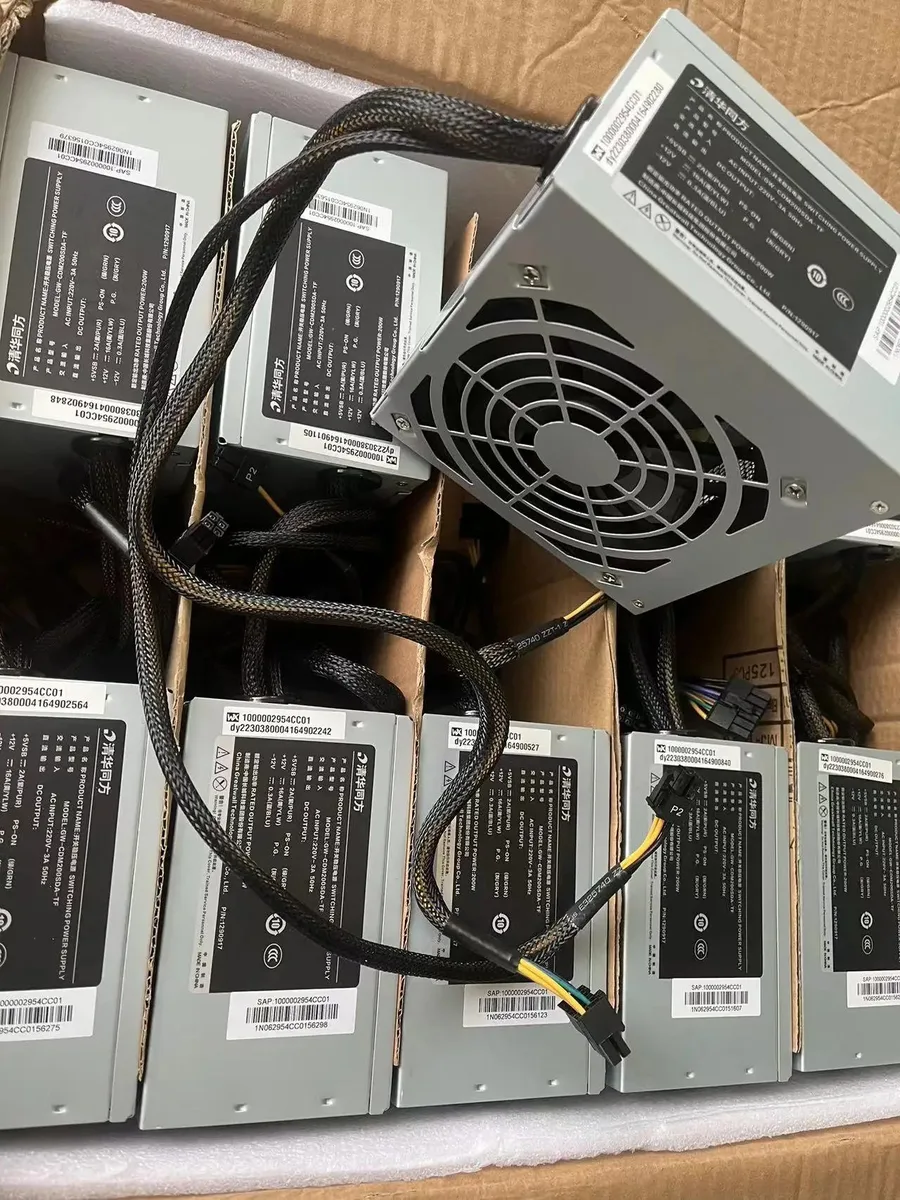 Silver rectangular ATX power supply with 12-pin connector visible