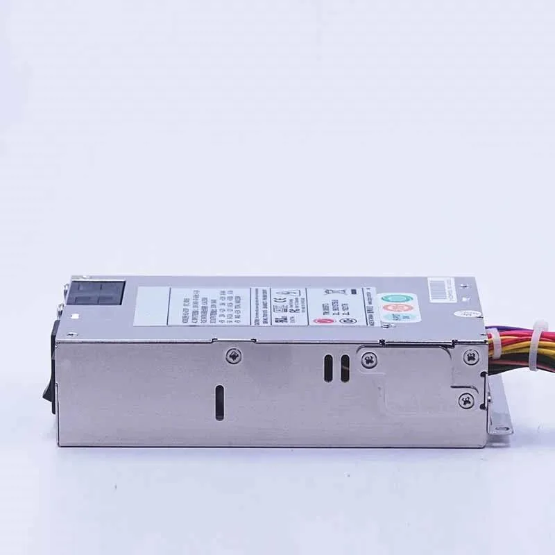 Compact 1U ATX power supply unit with matte metal casing and rear fan grille