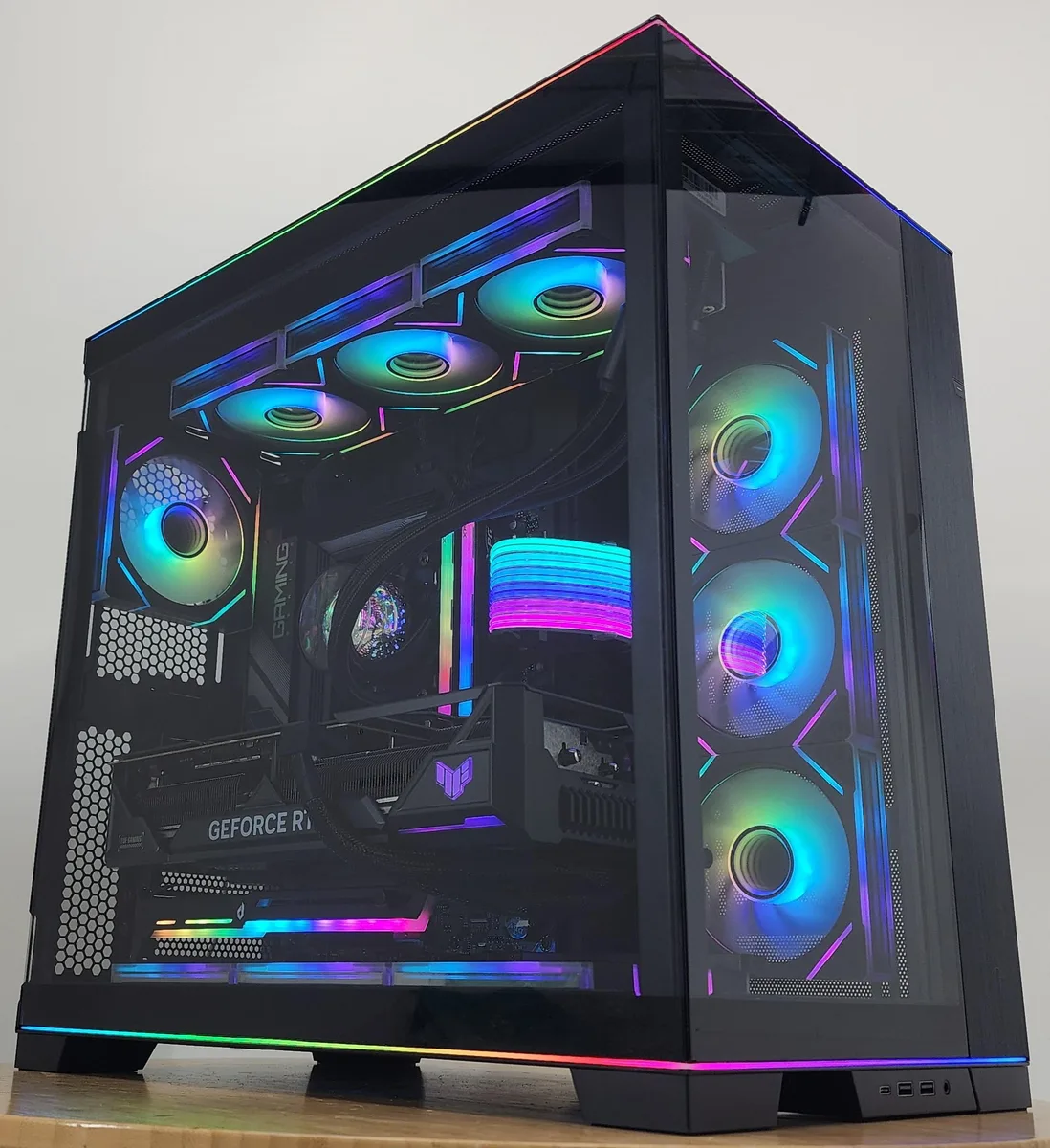 Lian Li O11 Dynamic EVO RGB mid-tower with 360 mm AIO and RTX 4080 visible through tempered glass side panel