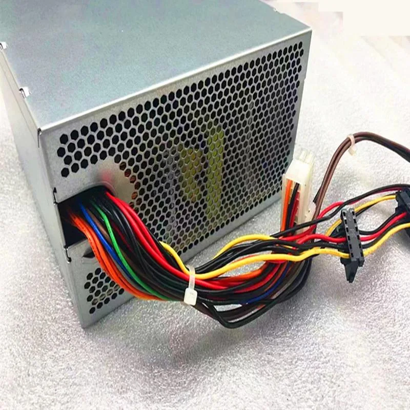Rectangular black ATX power supply unit with cooling fan grille and cable bundle