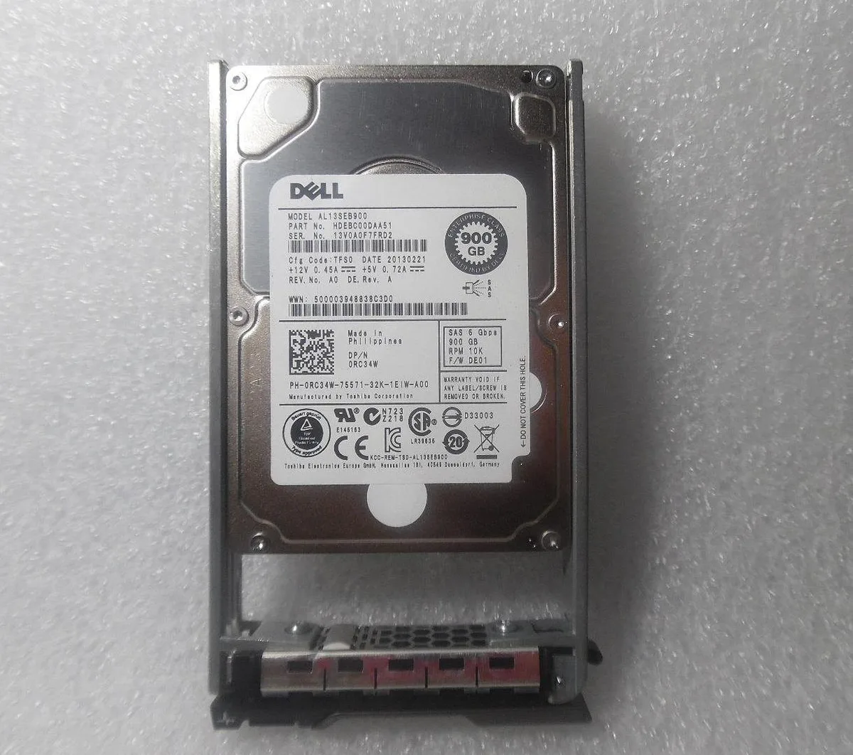 Silver 2.5-inch SAS hard drive with green circuit board visible