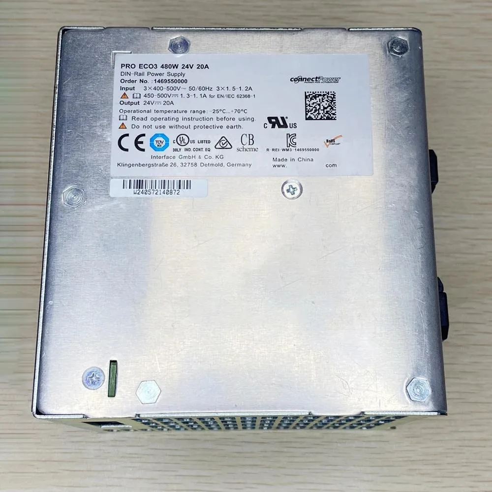 Silver DIN-rail power supply unit with front terminal block and ventilation slots