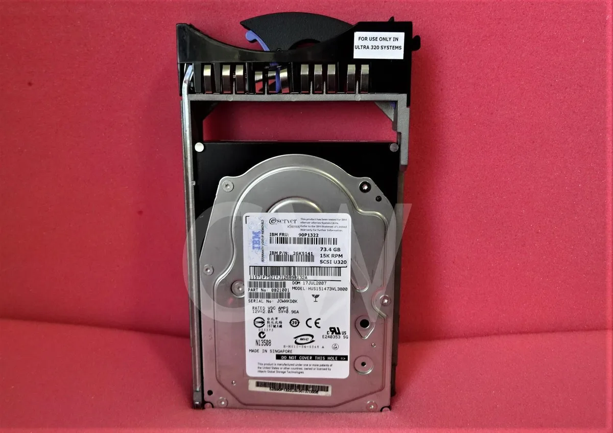 Silver 3.5 inch internal hard drive mounted in a metal caddy tray