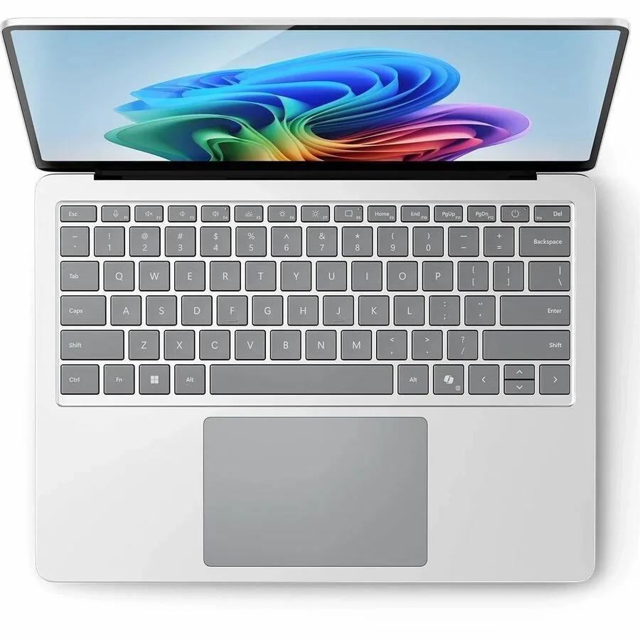 Platinum aluminium 13.8 inch notebook closed on a plain background