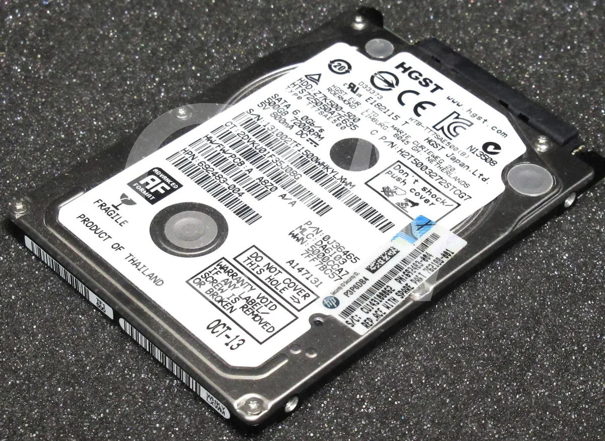 Silver rectangular 2.5 inch SATA hard drive with circuit board visible on underside