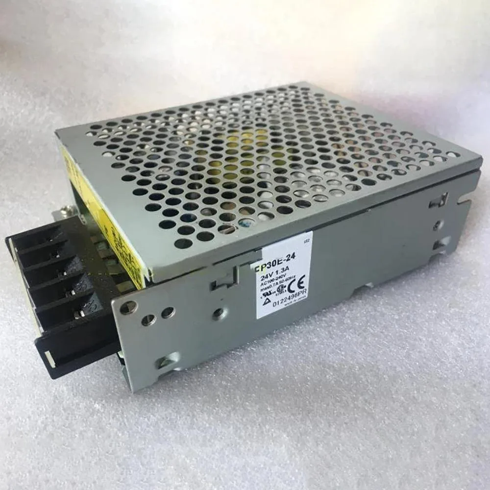 Compact rectangular ATX power supply unit with metal casing and label showing 24V 1.3A 30W