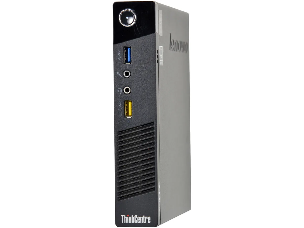 Compact black and silver mini desktop unit, cube shaped with front ports and ventilation grille